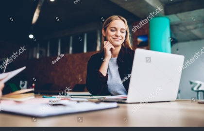 stock-photo-successful-female-grapic-designer-watching-tutorial-about-creative-ideas-at-laptop-computer-during-1033103851